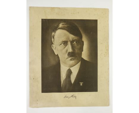 A German Third Reich lithographic portrait of Adolf Hitler, with facsimile signature, un-framed, 41 cm x 33 cm overall