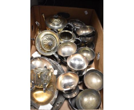 A selection of vintage silver plated table serving wares including sundae dishes, tea sets and trays.