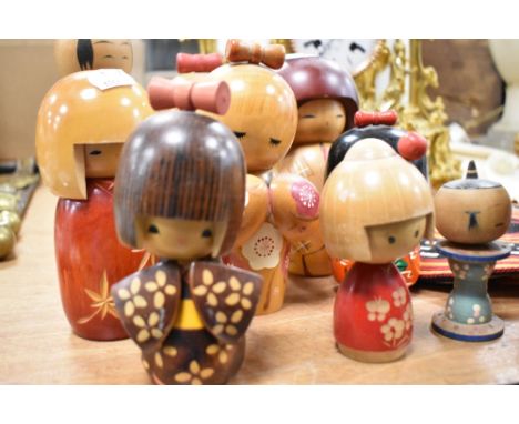 Ten vintage and modern Japanese wooden Kokeshi dolls hand crafted and decorated.