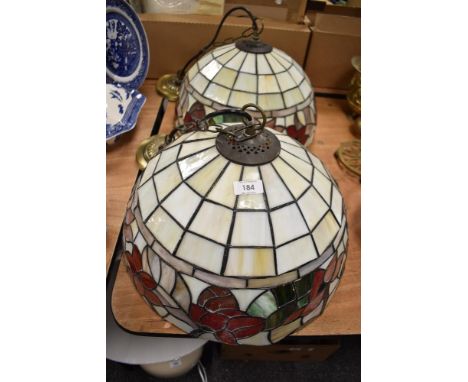 Two vintage Tiffany style leaded light ceiling shades with floral designs.