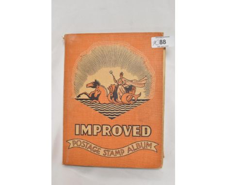 A vintage stamp album containing a selection of stamps or British and Foreign interest.