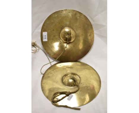 A pair of early 20th century musical cymbals.