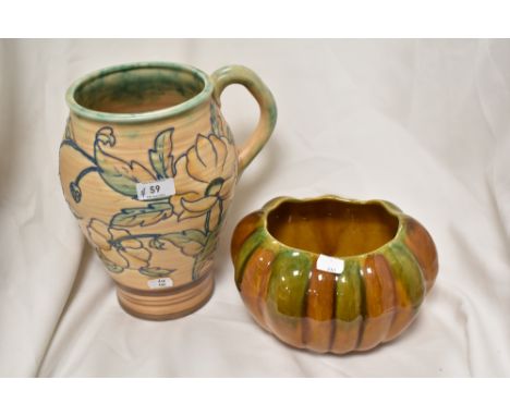 A 1930s Royal Cauldon jug, having tube lined poppy design in the manner of Charlotte Rhead, impressed with 603 to underside, 