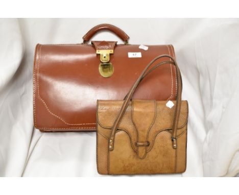 A vintage leather Gladstone style bag with a similar leather handbag.