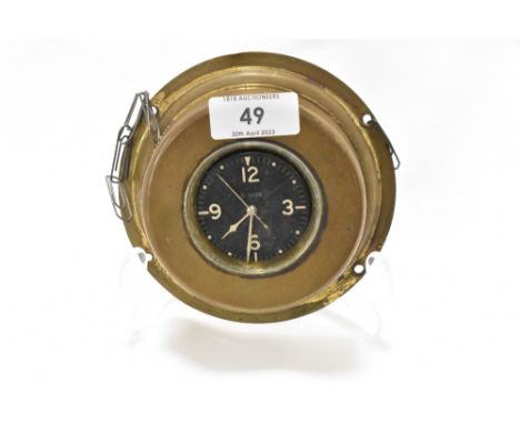 An early 20th century dashboard clock with brass case possibly aviation or motor related.