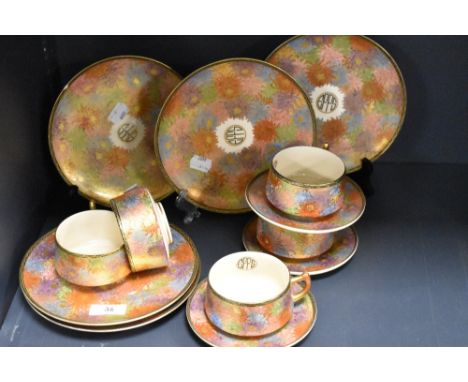 A Japanese Satsuma ware part tea service decorated in the millefiori pattern with gilt decoration.