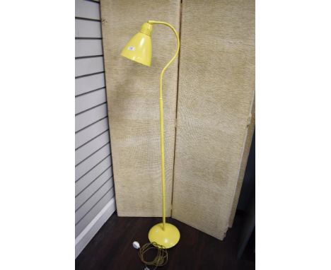 A vintage standard lamp in yellow.