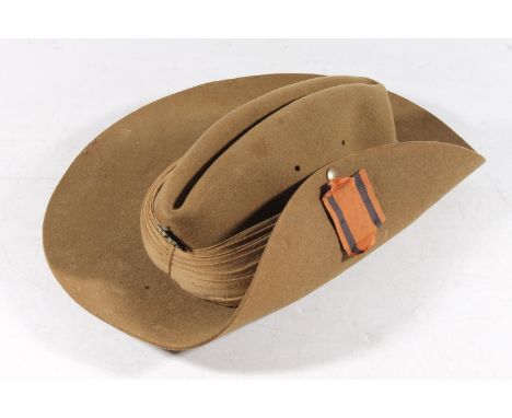 WWII era slouch hat by Moores of London, size 6 7/8, the leather sweat band stamped with War Department arrow and dated 1943,