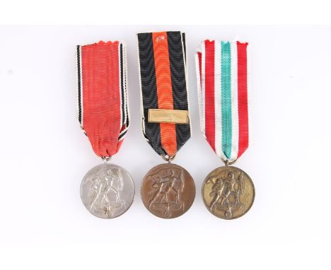 Nazi German WWII occupation medals to include Sudetenland Medal 1938 with Prague clasp, The Return of Memel Commemorative Med