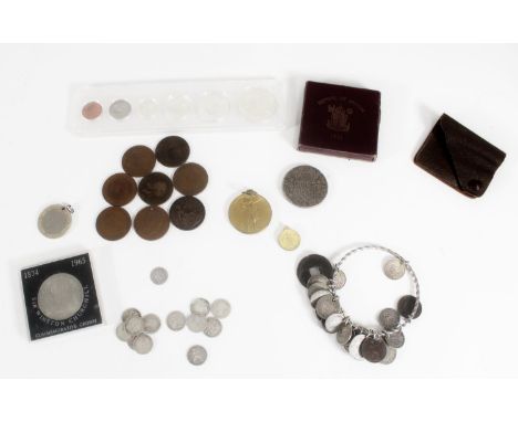 Coin art jewellery, a white metal bangle with coin charms to include Italian 1 lira 1869, British Maundy fourpence 1826, Char