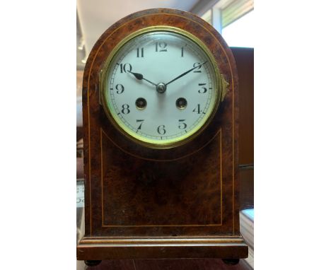 A&nbsp;French mantle clock, in a burr walnut case, the white enamel dial with Arabic numerals, the movement striking on a gon