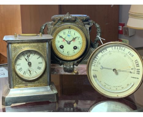 An Aneroid barometer and thermometer, diameter 14 cm, together with a French mantel clock on a onyx base, lacking surmount, a