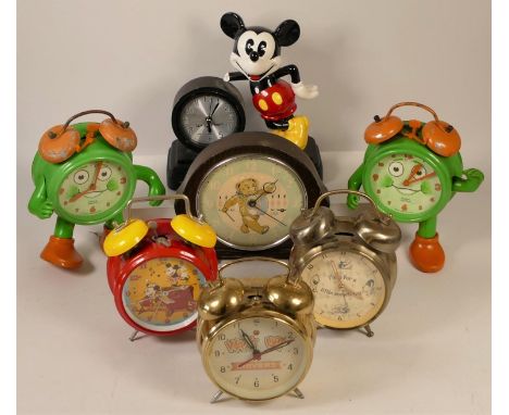 A collection of clocks to include, a boxed Wallace and Gromit alarm clock, Mickey Mouse alarm clocks, together with other nov