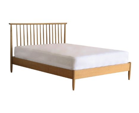 An Ercol Teramo king size bed frame, with turned and tapered spindles, handcrafted from solid pale oak and oak veneers, unass