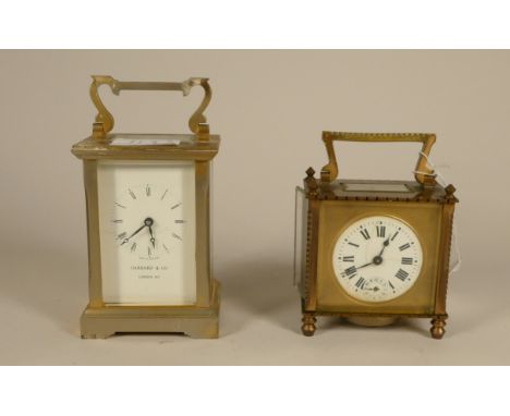 A Garrard &amp; Co of London brass carriage clock, together a brass alarm carriage clock, the dial with Roman numerals and su