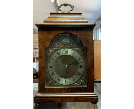 A Tempus Fugit burr walnut bracket clock, the silvered chapter ring with Roman numerals