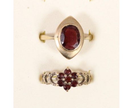 A 9ct gold garnet panel ring R and a 9ct gold garnet cluster ring, N, 5.2gm 