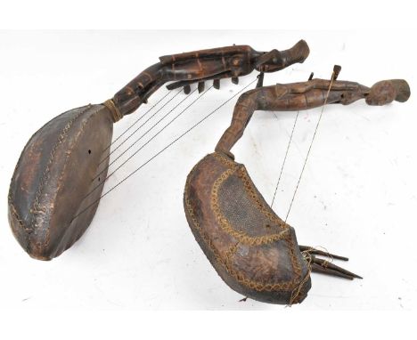 Two Mangbetu, Democratic Republic of Congo Kudi (arched harp) with carved figural detail, height approx 60cm.Provenance: This