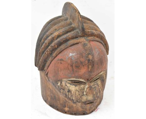 A Sowei Sande, Sierra Leone, helmet mask with traces of pigmentation, height 34cm.Provenance: This collection has come to us 