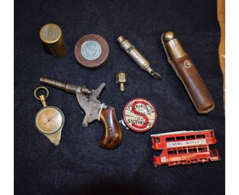 An early 20th century German single-shot pocket or muff pistol, 6cm barrel stamped D.R.G.M., two piece wooden grip; a Schrade