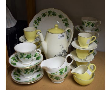A Staffordshire part tea set printed with trailing vine leaves; a British Anchor coffee set, printed with heron birds, coffee