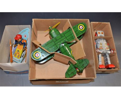 A Curtiss clockwork tin plate plane, boxed; a similar robot, boxed; others similar 