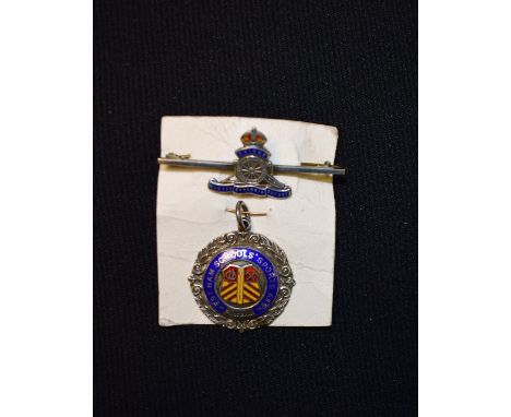 A silver and enamel Royal Artillery brooch; a West Ham Schools silver and enamel football fob