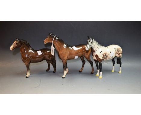 A Beswick Appaloosa Stallion; a gloss brown Chestnut stallion; a gloss brown Chestnut mare (3)