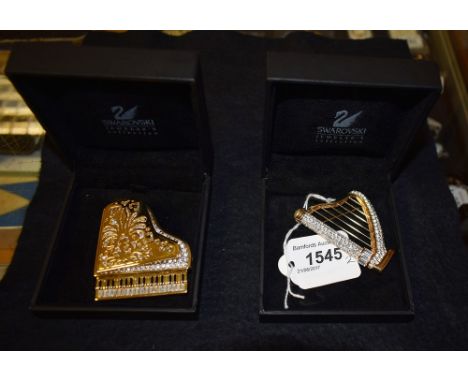 A Swarovski crystal grand piano brooch, boxed, another, harp (2)