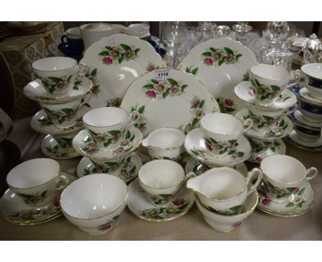 A Regency bone china floral decorated tea service for twelve, including cups, saucers, side plates, etc.; quantity