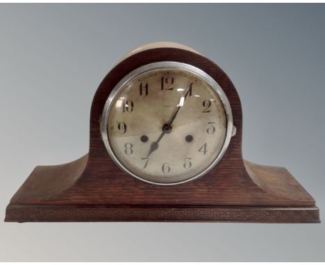 An oak cased Enfield eight day mantel clock with silvered dial 
