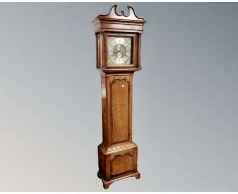 A George III inlaid oak longcase clock with brass and silvered dial signed Joseph Atkinson, pendulum and weights. (AF)