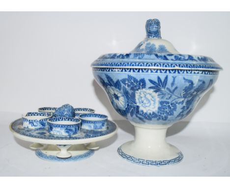 Early 19th century pearlware flow-blue egg cup stand and warmer, the interior with four egg cups and stand and dog finial, ex