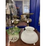 Victorian oil lamps black ceramic bases, brass columns, one with damage, one with glass reservoir