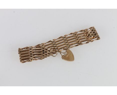 9ct gold six bar gate link bracelet with 9ct gold heart lock closure, maker A S J 1976, 21.9g. 