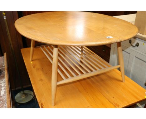 Ercol blonde elm oval coffee table, model 454 "Supper Table", with spindle shelf below, 100cm long and 43 cm tall