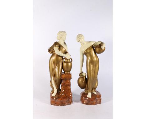 Pair of pottery figures of water carriers in the style of Goldscheider or Royal Dux, 34cm tall. (2) 