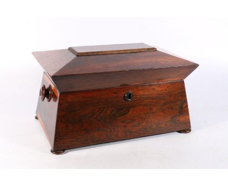 Victorian rosewood tea caddy, the sarcophagus top opening to reveal a fitted interior having central mixing well flanked by l