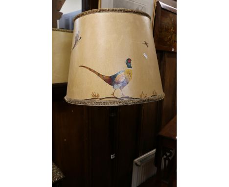 Mahogany turned standard lamp raised on reeded base, 151cm with shade. 