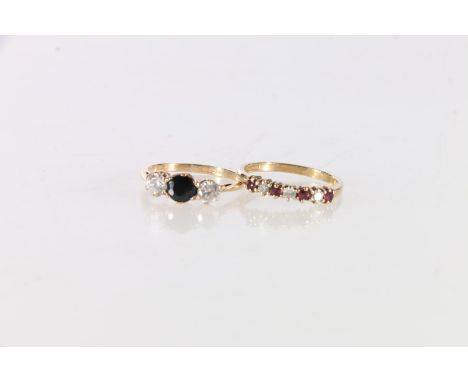 9ct gold diamond and ruby set ring, size O, and a 9ct gold three stone dress ring, size M, gross weight 3.7g. 