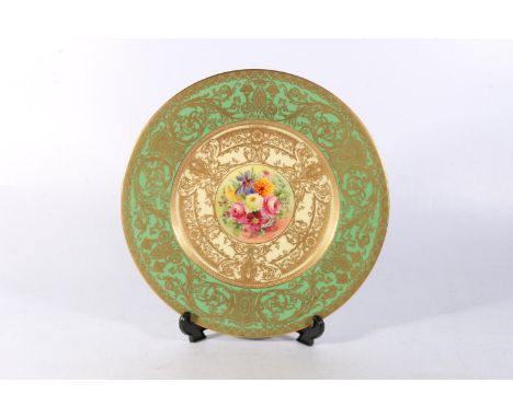 Royal Worcester porcelain cabinet plate having green outer band embellished with gilding framing a central hand painted vigne