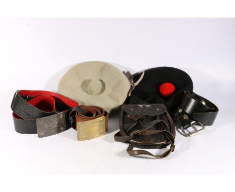 Two kilt belts with Celtic style metal buckles, a leather sporran and two Scotch bonnets.&nbsp; 