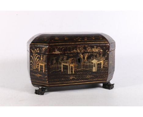 Chinese black lacquered tea caddy with gold painted decoration raised on carved paw feet, 19.5cm wide.&nbsp; 