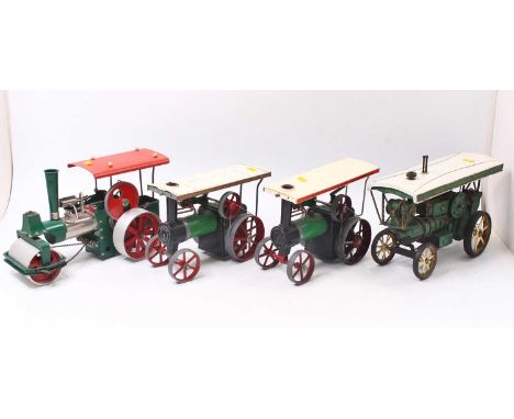 Three steam traction engines and road rollers, including a Wilesco road roller, in green, red and silver, unboxed, in very go