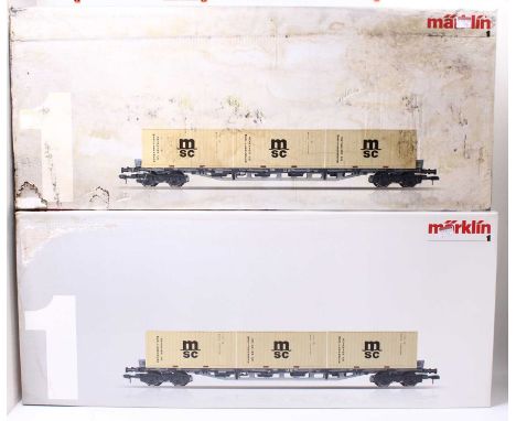 Two Marklin Gauge 1 container wagons, item no. 58708, in original boxes, with three 20ft MSC containers in each box. Wagons a