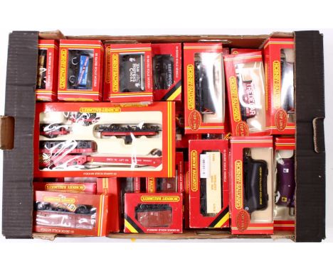 One tray containing 00 gauge Triang and Hornby 4 wheeled wagons, and others including hopper wagons, a crane, cement wagons, 