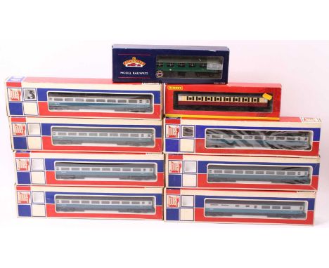 One tray of 00 gauge coaches to include seven BR Mk 3 coaches in blue/grey livery, a Hornby crimson and cream suburban coach,