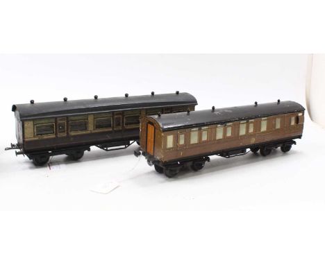 A pair of bogie corridor coaches consisting of a Leeds Model Co. Ltd. LMS paper-sided corridor coach, complete with original 