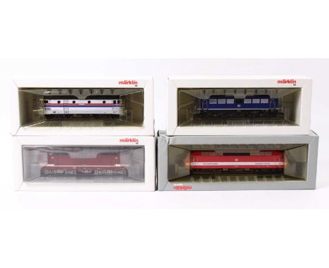 Four Marklin locos, including a BR 110 class in DB blue and black, with some yellowing to the box insert, an X995 Amtrak in s