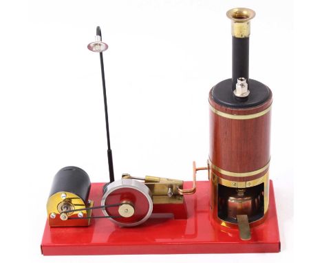 A stationary engine, comprising a vertical boiler, connected to a horizontal single oscillating cylinder engine, with power t